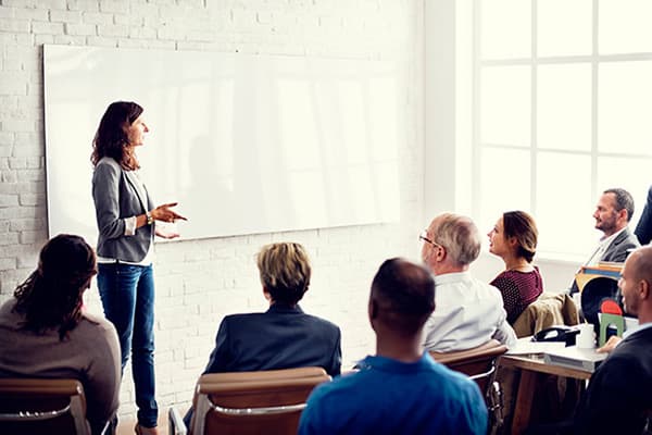 woman leading a group meeting